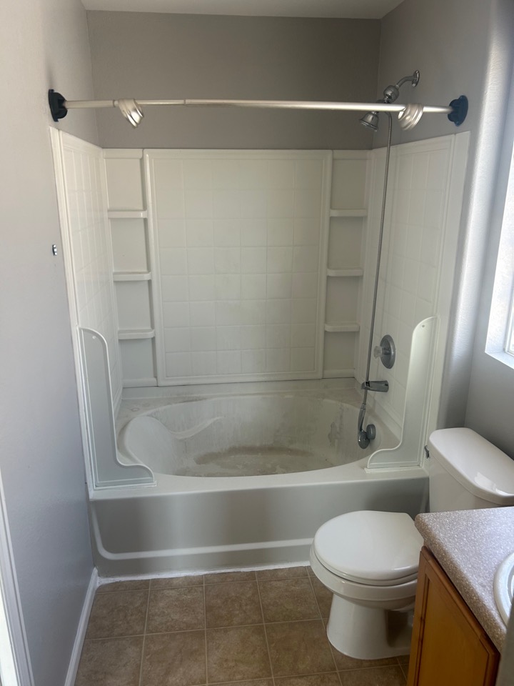 An old tub and wall surround, before the tub was converted to a shower